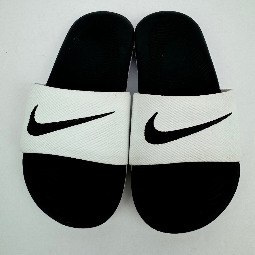 Nike Kawa kids sandal/ slides. Non slip rubber sole. Black, white.